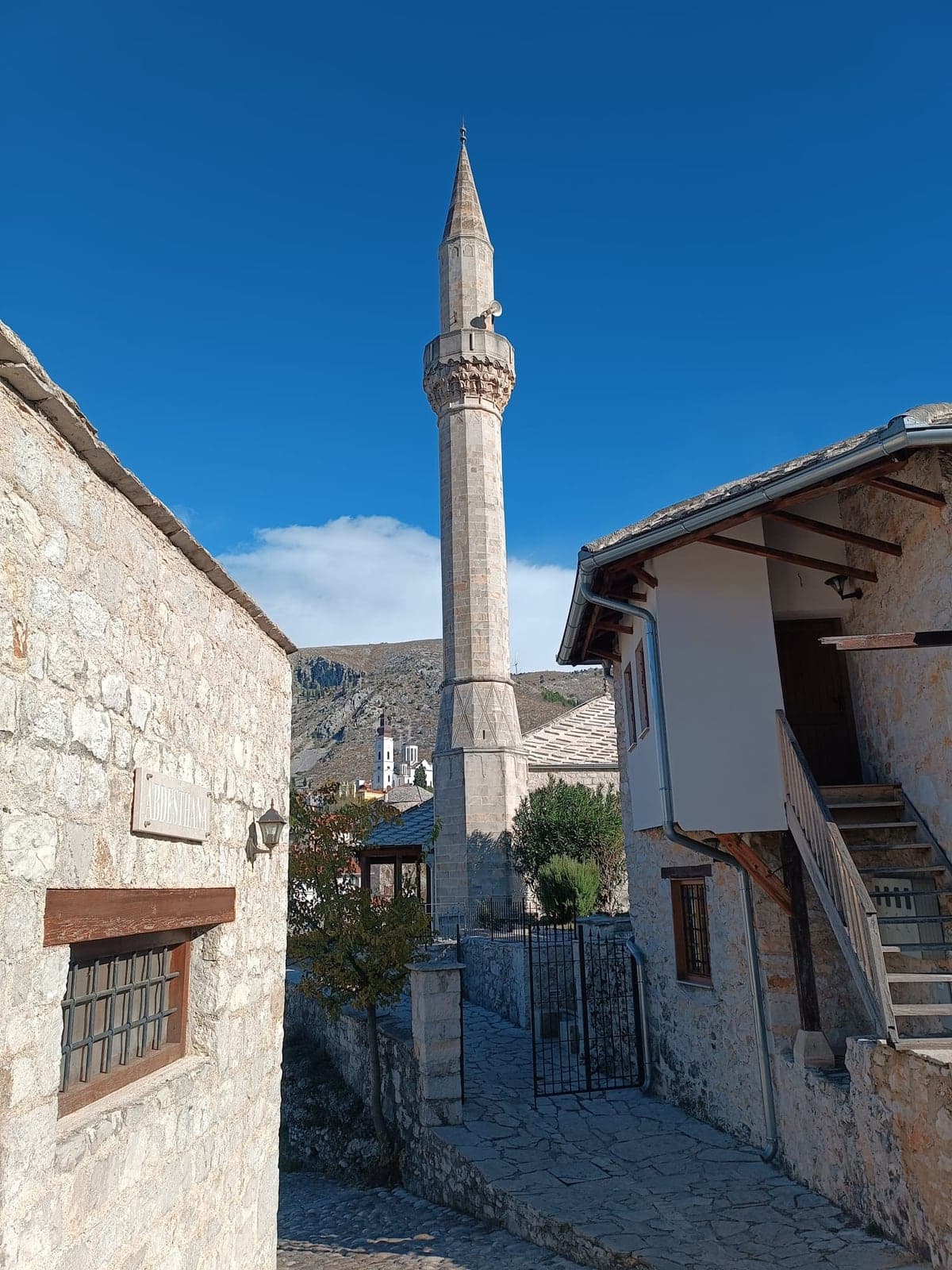Historic mosque and minaret beside the river in Mostar, Bosnia and Herzegovina