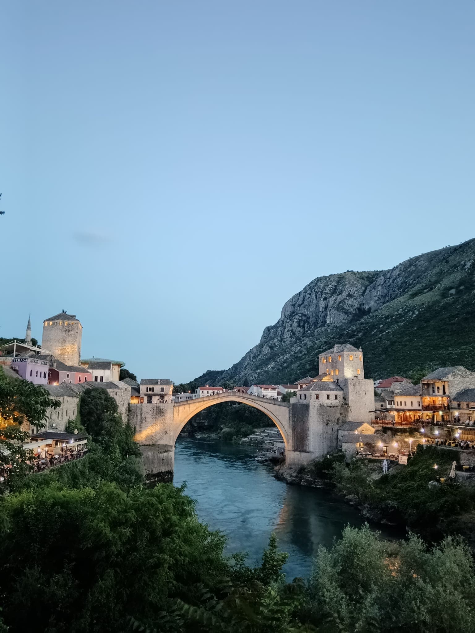 Mostar Old Bridge at dusk above the Neretva River