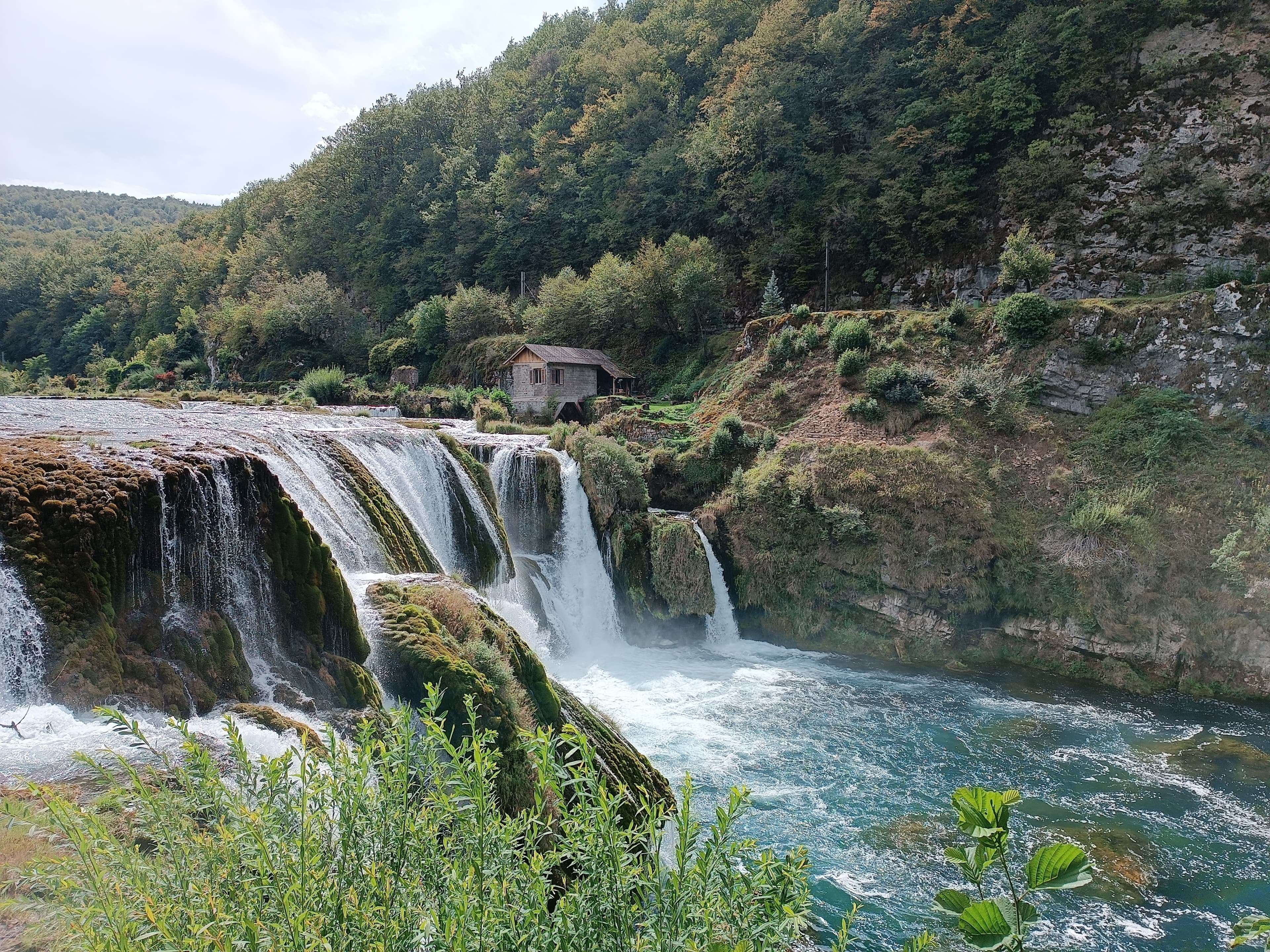 Group rafting on a clear river in Bosnia